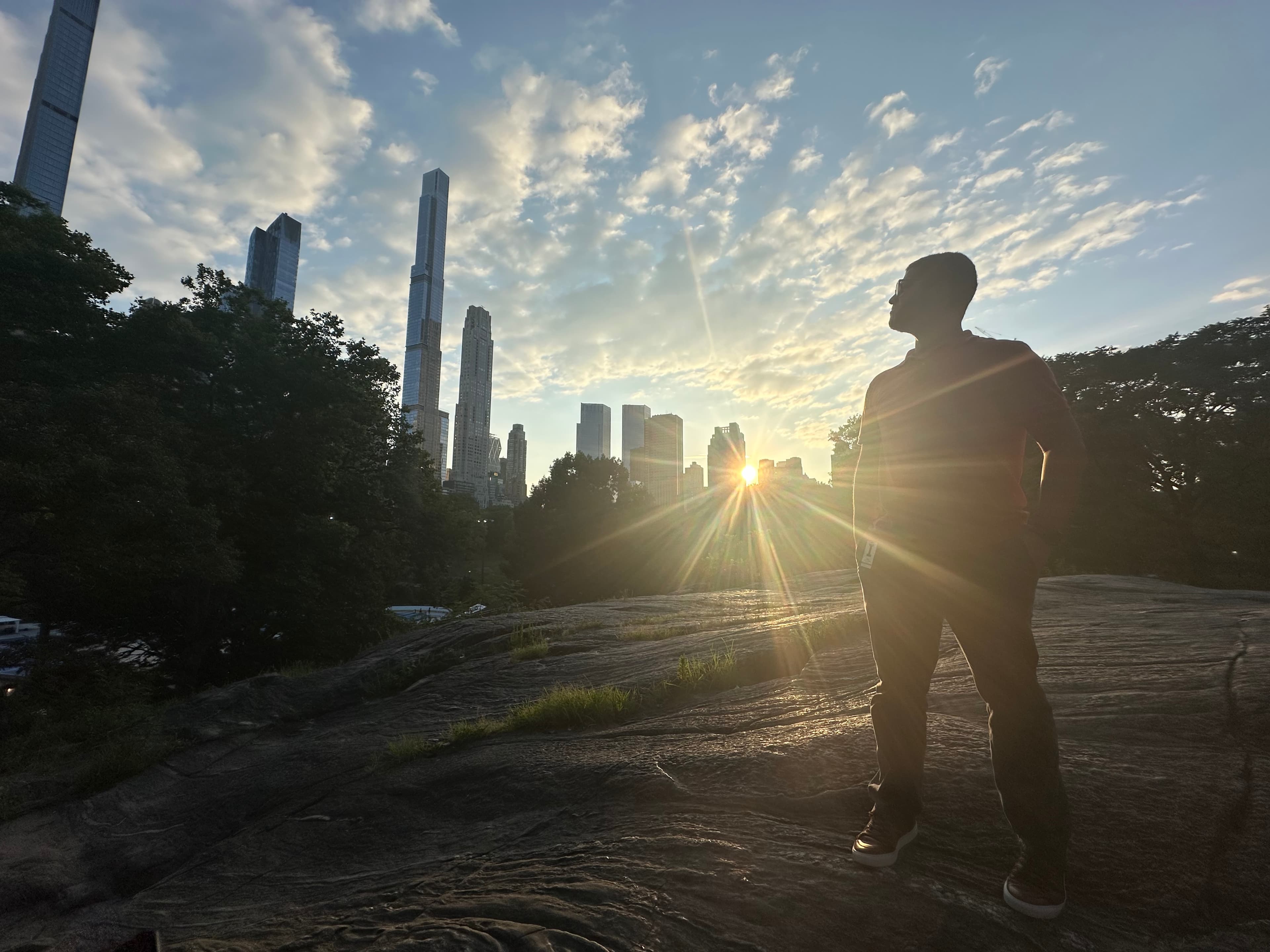 Tomas standing on a rock in Central Park